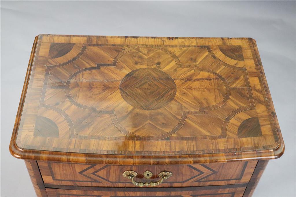 A French Regence olivewood and rosewood bowfront commode, c.1725, W.2ft 8in. D.1ft 9in. H.2ft 6in.